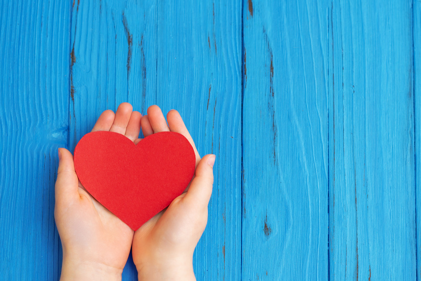 Red Heart in Child's Hands